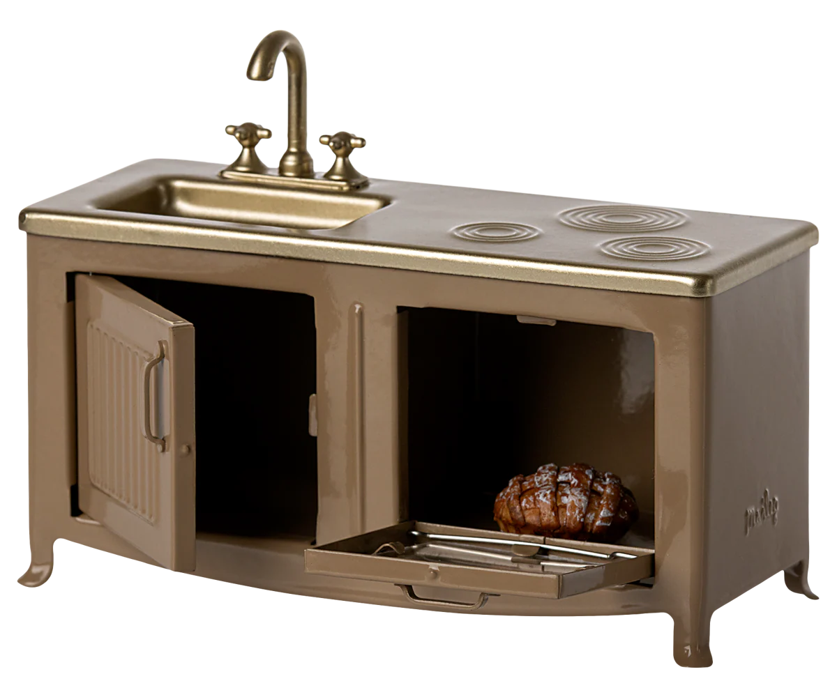 The Maileg Kitchen is a miniature bronze-colored playset with a sink, four-burner stove, opening oven with roast and tray, plus classic faucets—ideal as an accessory for dollhouses or Mouse family homes.