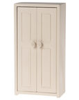 Cream-colored Maileg wardrobe with paneled doors and round handles, perfect for dollhouse play, from Bungalow Furniture.