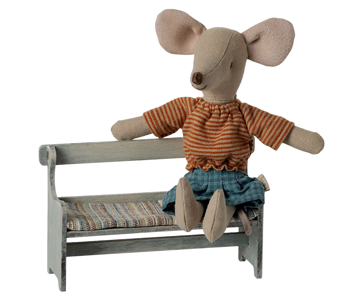 Maileg Mouse Bench with striped mouse on patterned wooden seat, Maileg toy, whimsical nursery decor.