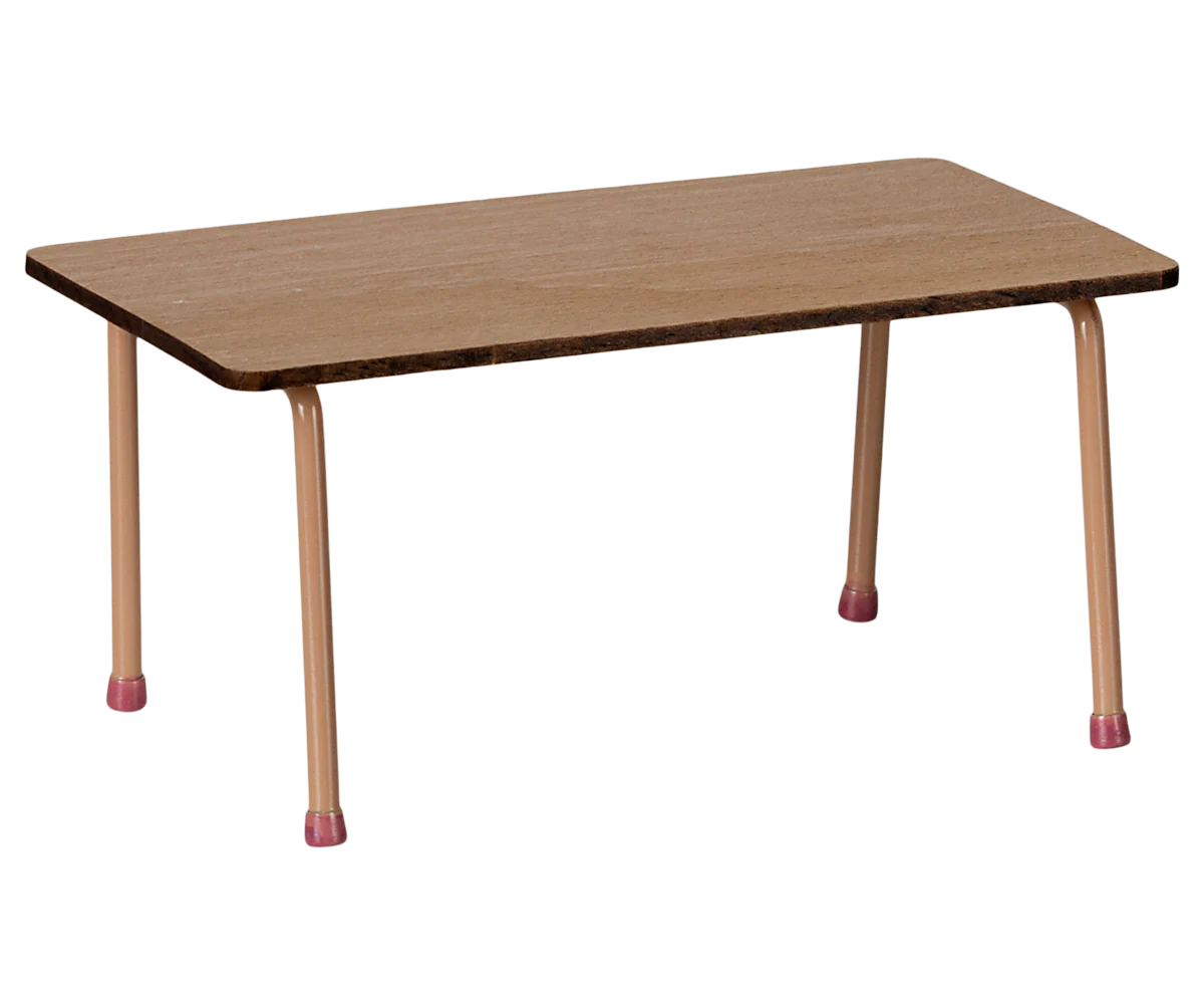The Maileg Table and Chairs set by Maileg features a small rectangular beech wood table with four light pink metal legs, each tipped with matching pink rubber caps—ideal for charming any Mouse Hole Farmhouse setting.
