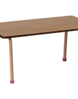 The Maileg Table and Chairs set by Maileg features a small rectangular beech wood table with four light pink metal legs, each tipped with matching pink rubber caps—ideal for charming any Mouse Hole Farmhouse setting.
