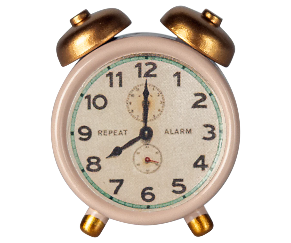 Maileg powder alarm clock shows 8:00, a charming accessory for Mouse Hole Farmhouse dollhouses.