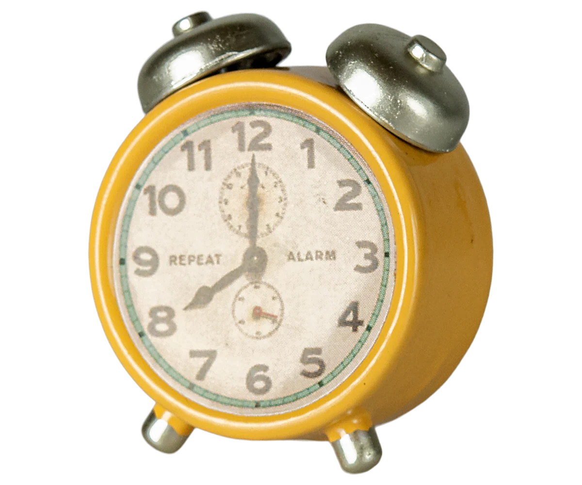 Yellow vintage-style metal alarm clock with silver bells by Maileg, white face, black numbers set to 8:00.