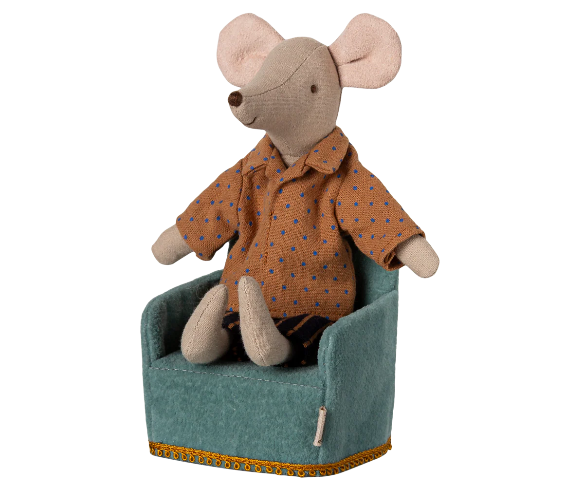 Maileg stuffed mouse in brown polka-dot shirt sitting on yellow-trim Maileg folding chair, playful nursery decor.