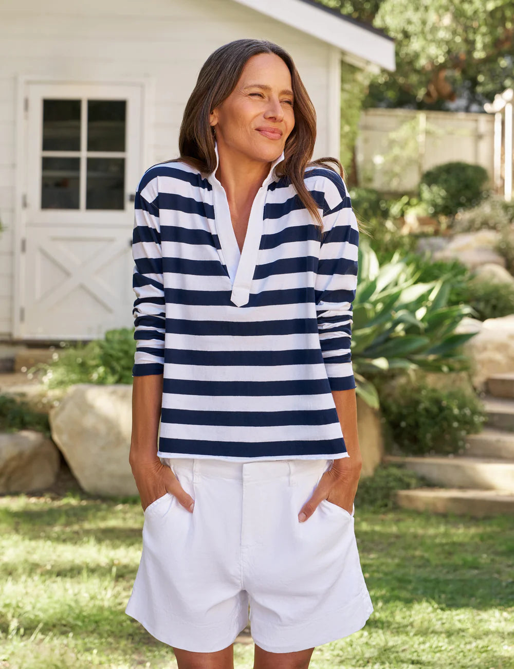 Frank & Eileen Patrick Henley Jersey in Nautical Stripe worn outdoors, styled with a green garden backdrop.