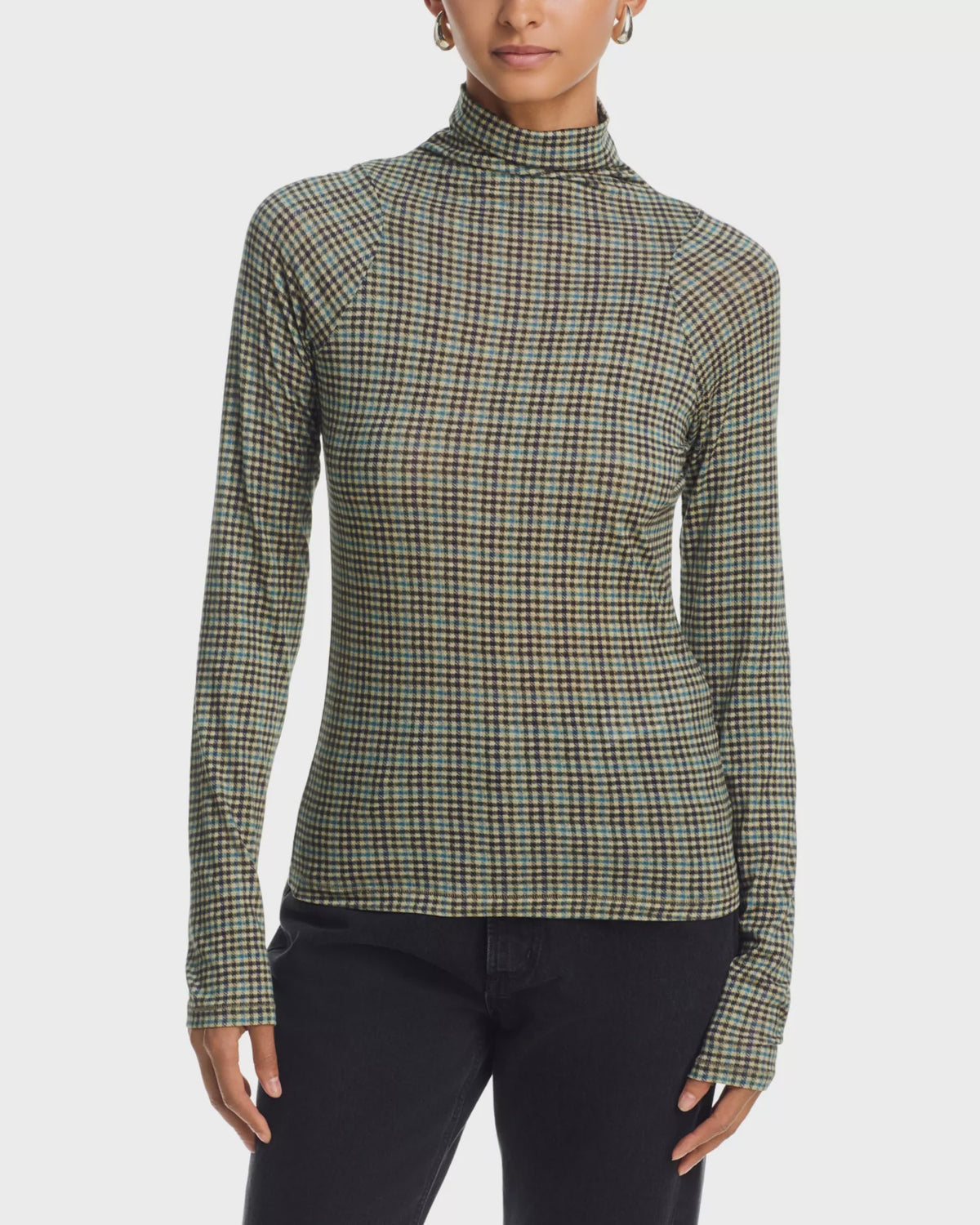 Rag & Bone black shaw paneled turtleneck sweater and pants, modern styling against a plain white background.