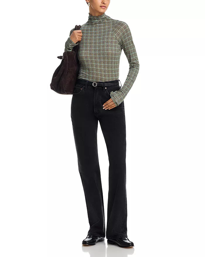 Rag & Bone black shawl-paneled turtleneck with matching jeans and accessories, styled against a white backdrop.