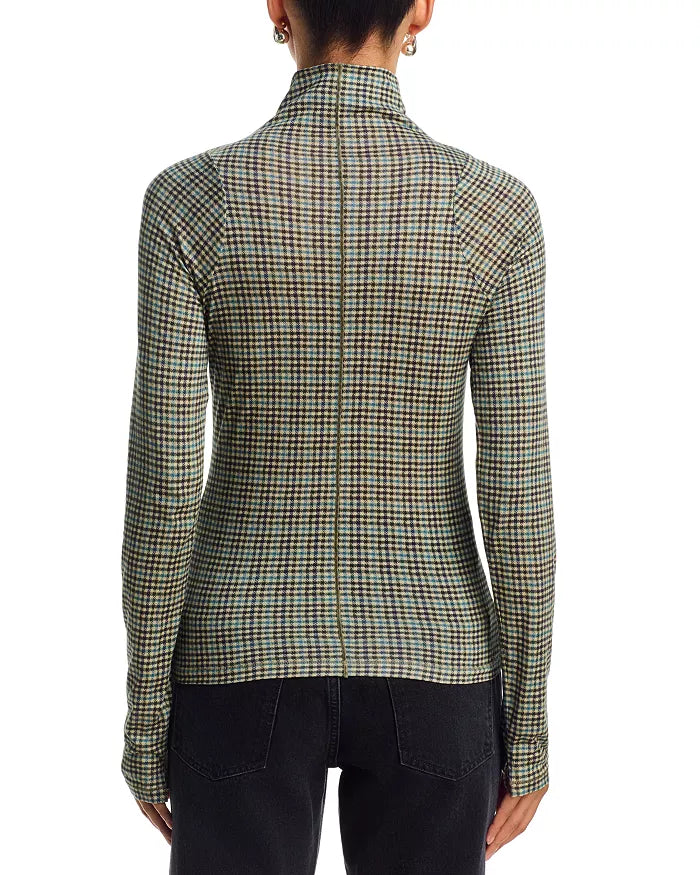Black Rag & Bone long sleeve paneled turtleneck with black jeans, back view, against white background.