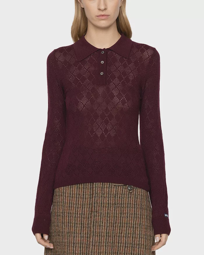 Burgundy argyle polo sweater with a brown plaid skirt by Sea New York, styled against a white background.