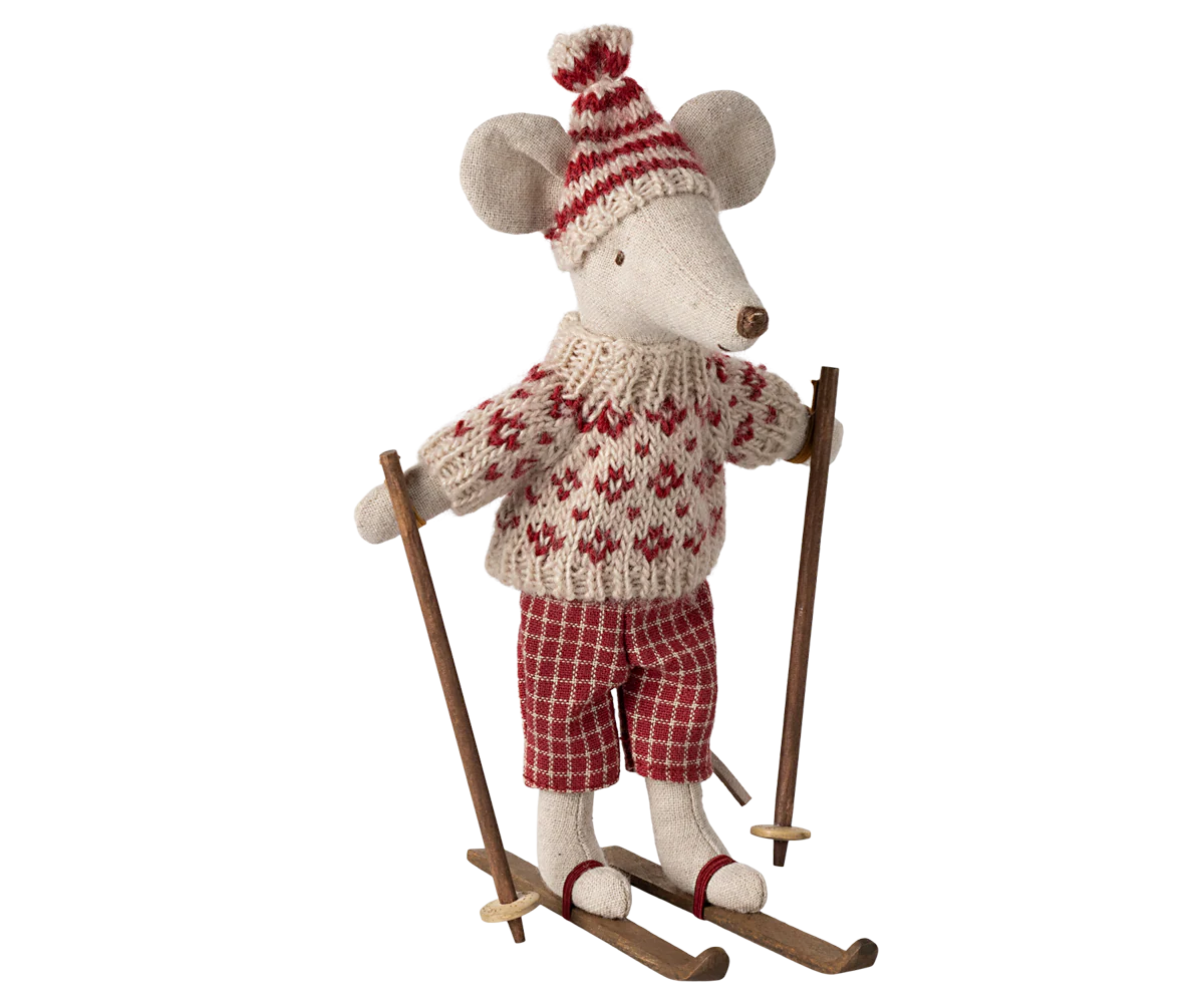 The Maileg Winter Mouse by Maileg wears a red and white sweater, plaid pants, and a pom-pom hat, standing on wooden skis with poles—ideal for fans of dressed mice and festive winter décor.