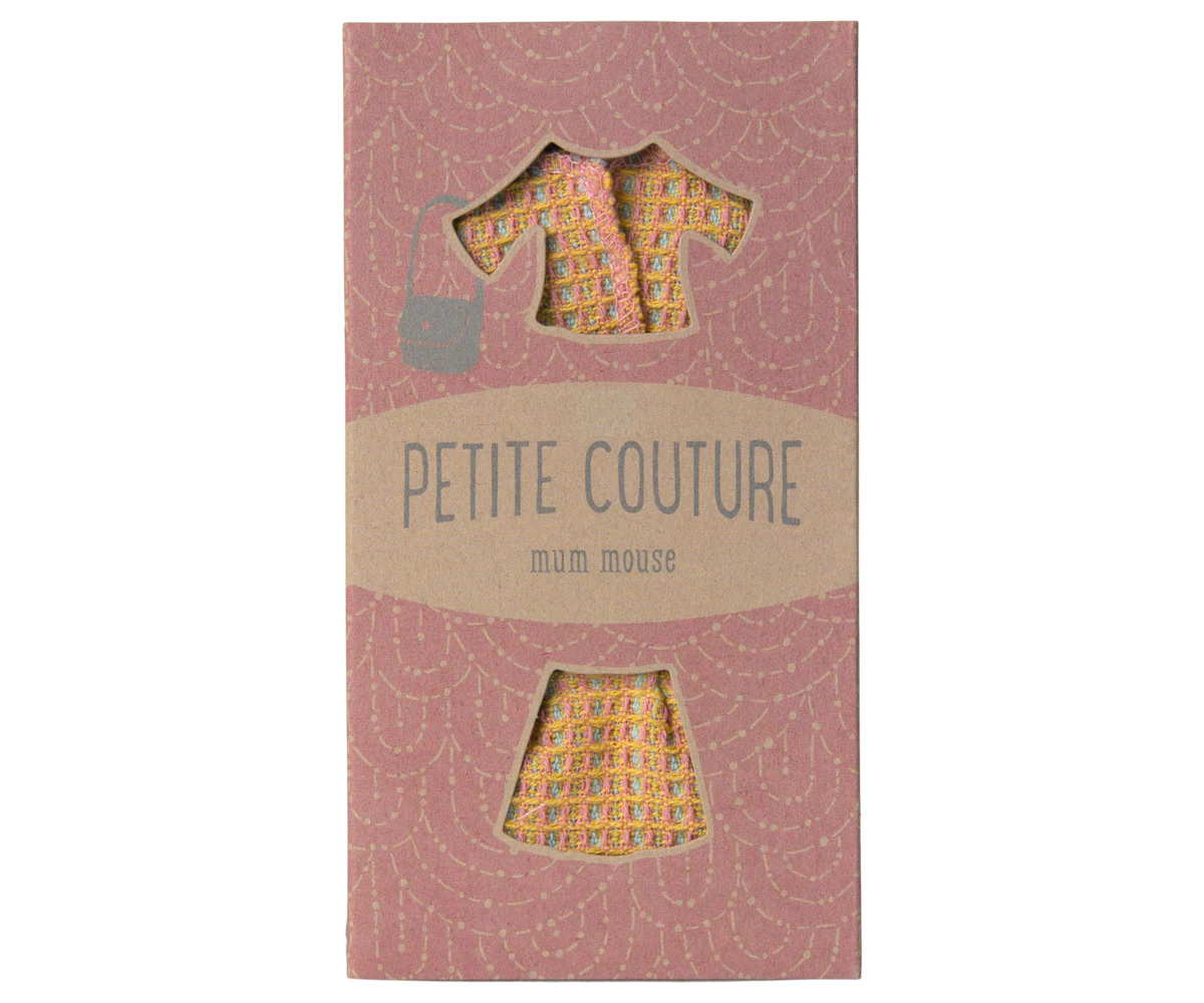 The Maileg Mum Suit by Maileg comes in a pink cardboard package with cutouts showcasing a patterned blouse, skirt, and stylish lady bag—charming clothes designed especially for your toy mouse.