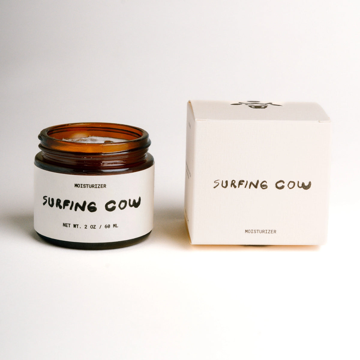 Faire SC Whipped Tallow Moisturizer in an amber glass jar beside its matching white cow-logo box.