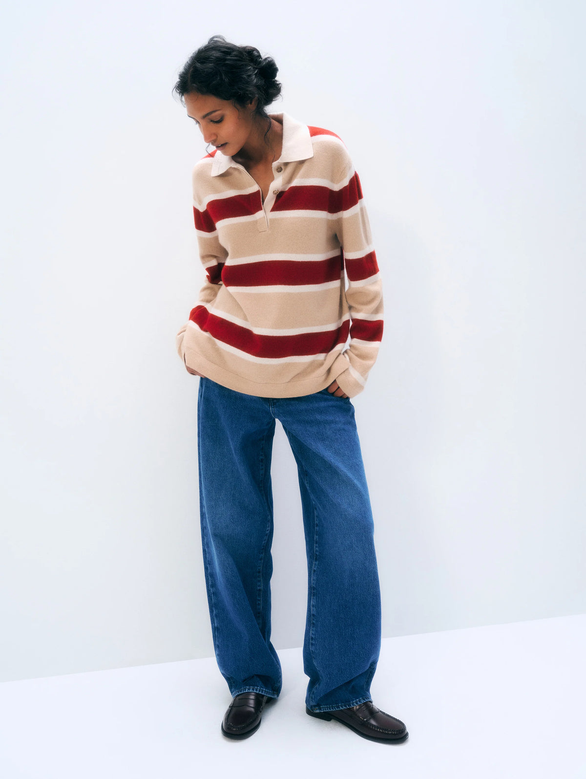 White + Warren Cashmere Rugby Stripe Polo in white with blue stripes, styled casually with wide-leg jeans and loafers.