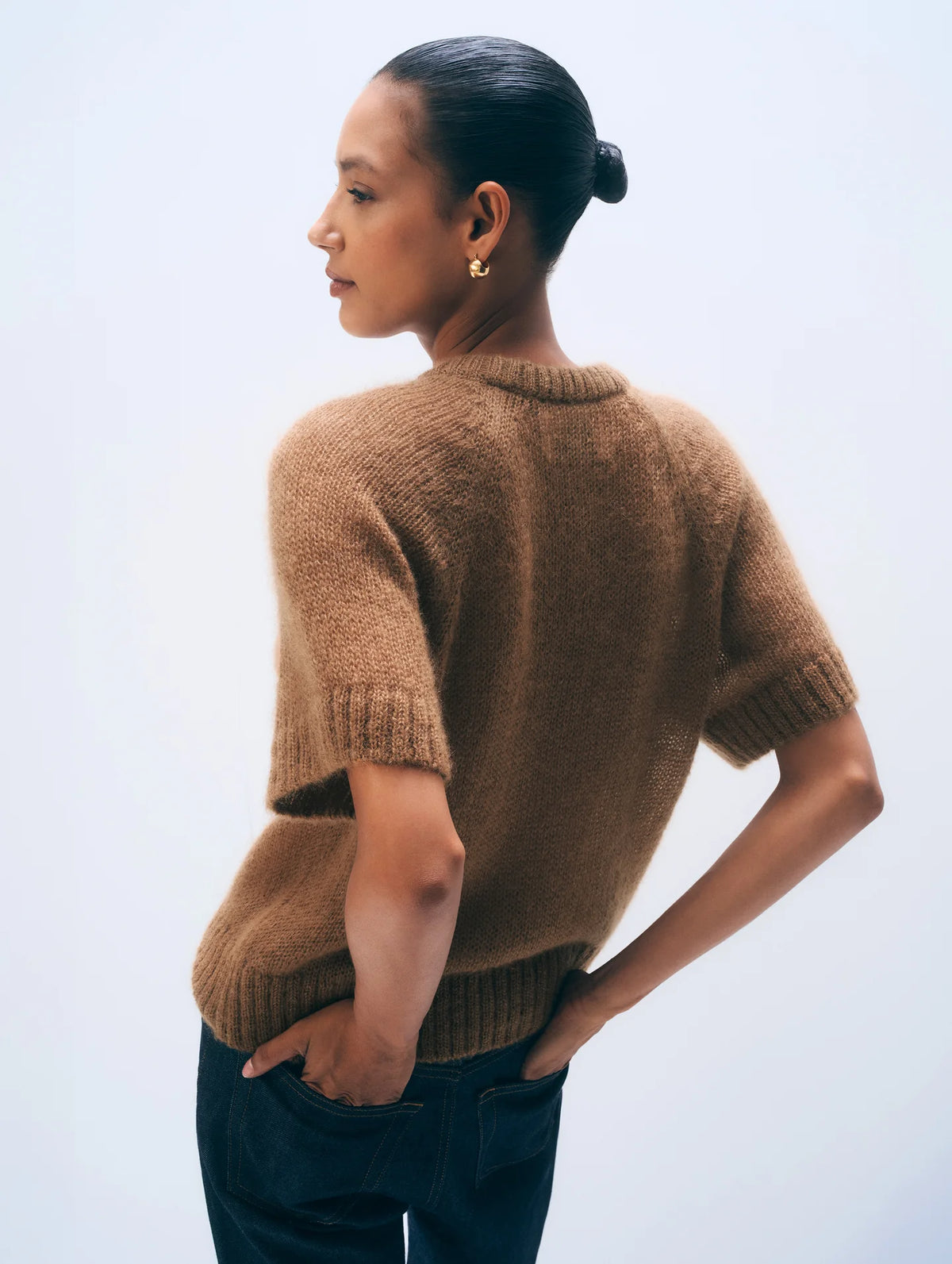 Brown Mohair Blend Tee by White + Warren styled with dark pants, modern casual look, hand on hip.