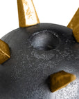 Close-up of the Punk Candleholder by The Import Collection, featuring dark gray and metallic gold spikes with a central circular hole, highlighting its bold industrial design against a white background.