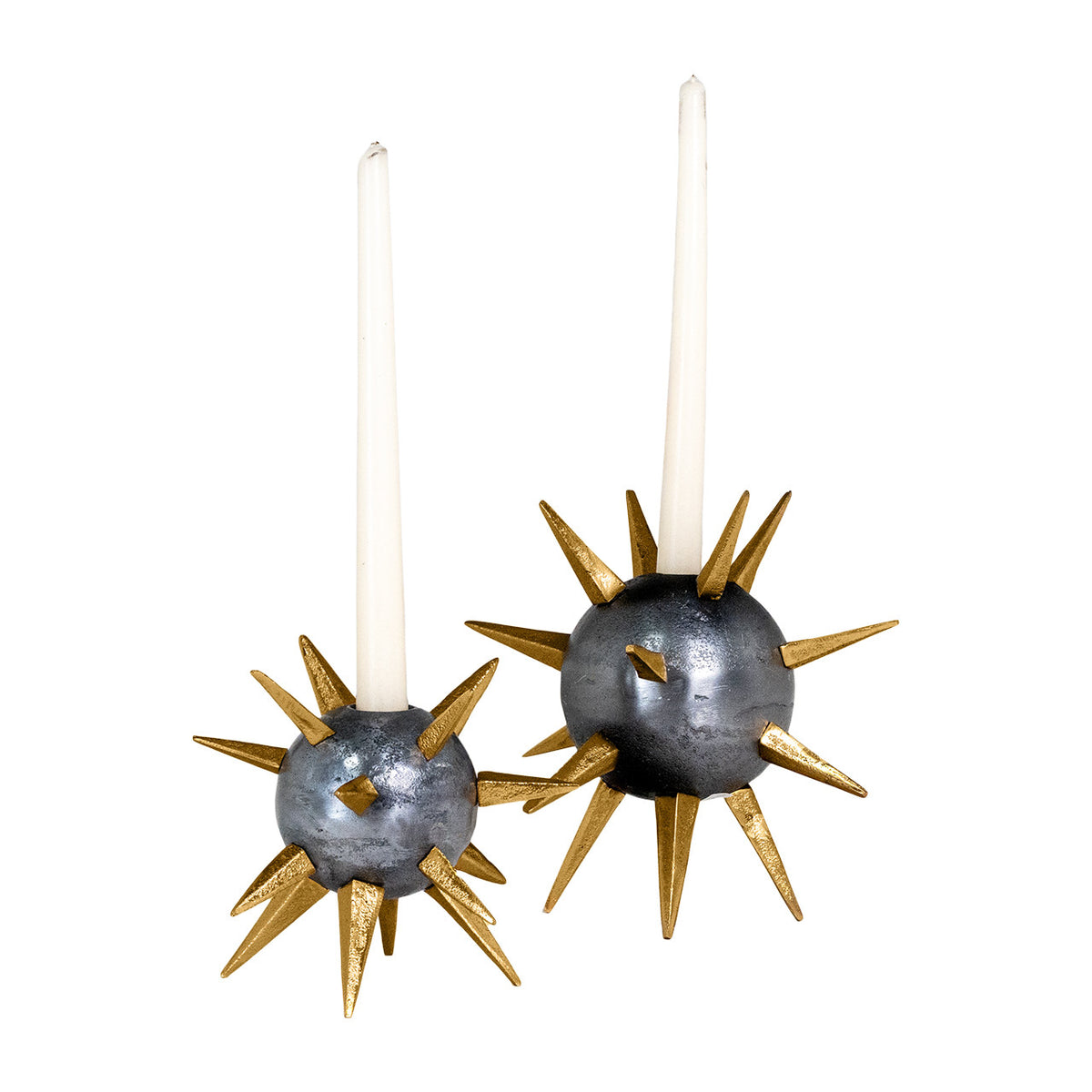 Two white taper candles sit in The Import Collection's Punk Candleholders—gold spike holders with metallic gray spherical bases, resembling sea urchins—for an edgy, industrial decor accent.