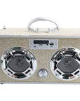 The Faire Gold Bling Wireless Boombox with FM Radio features a beige textured exterior, two large circular LED light-up speakers, a central control knob, and a silver handle, all set against a white background.