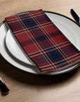Faire Brick Plaid guest towel on a plate with cutlery, set on a wooden table at Bungalow Furniture & Accessories.