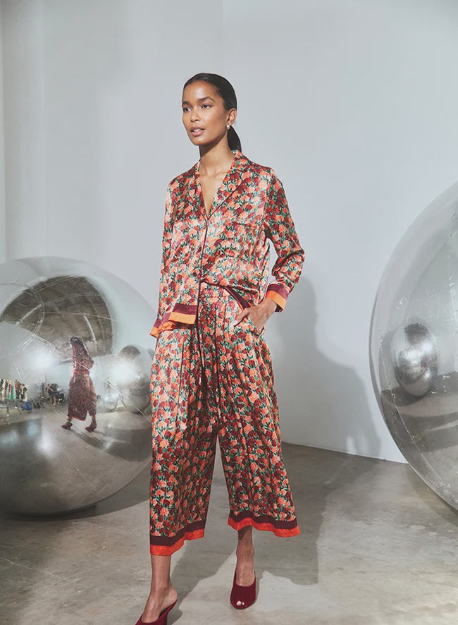 Roxy Top and Whisper Pant cropped trousers featuring orange and maroon trim.