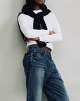 Denimist HAISLEY SLOUCH BF SLOANE INDIGO jeans styled with black sweater and white shirt, casual modern look.