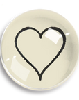 The Dome Crystal Paperweight by Ben's Garden is handcrafted in a New York studio and features a simple black heart outline at its center on a light background.