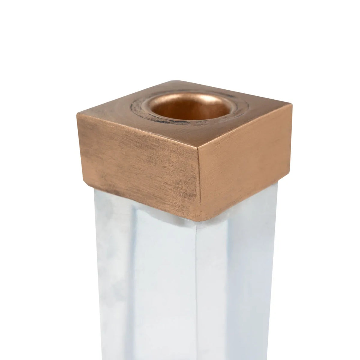 Square metallic bronze candleholder on a clear acrylic base by Bungalow Furniture &amp; Accessories.
