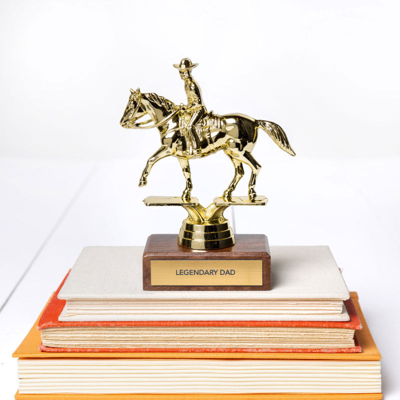 The Faire JE Trophy—a gold cowboy on horseback atop a wooden base with a "LEGENDARY DAD" plaque—makes an ideal gift for adults in Winston Salem wanting to celebrate or honor a special dad.