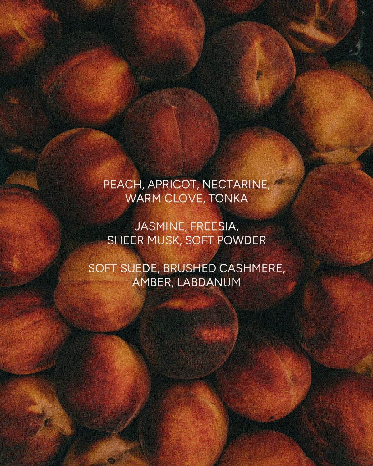 A stack of ripe peaches with text overlay: "Peach, apricot, nectarine..."—all in SWEET BOY 12 oz candle by Faire. Enjoy a non-toxic, clean-burning soy wax candle that captures fresh fruit fragrance notes.