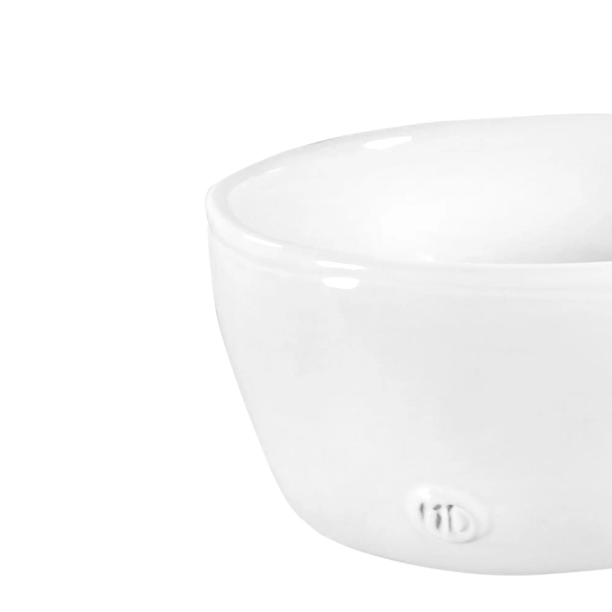A close-up of the Montes Doggett L Bowl No. 222, a simple white high-fired ceramic bowl with a small embossed logo on the side, set against a plain background.