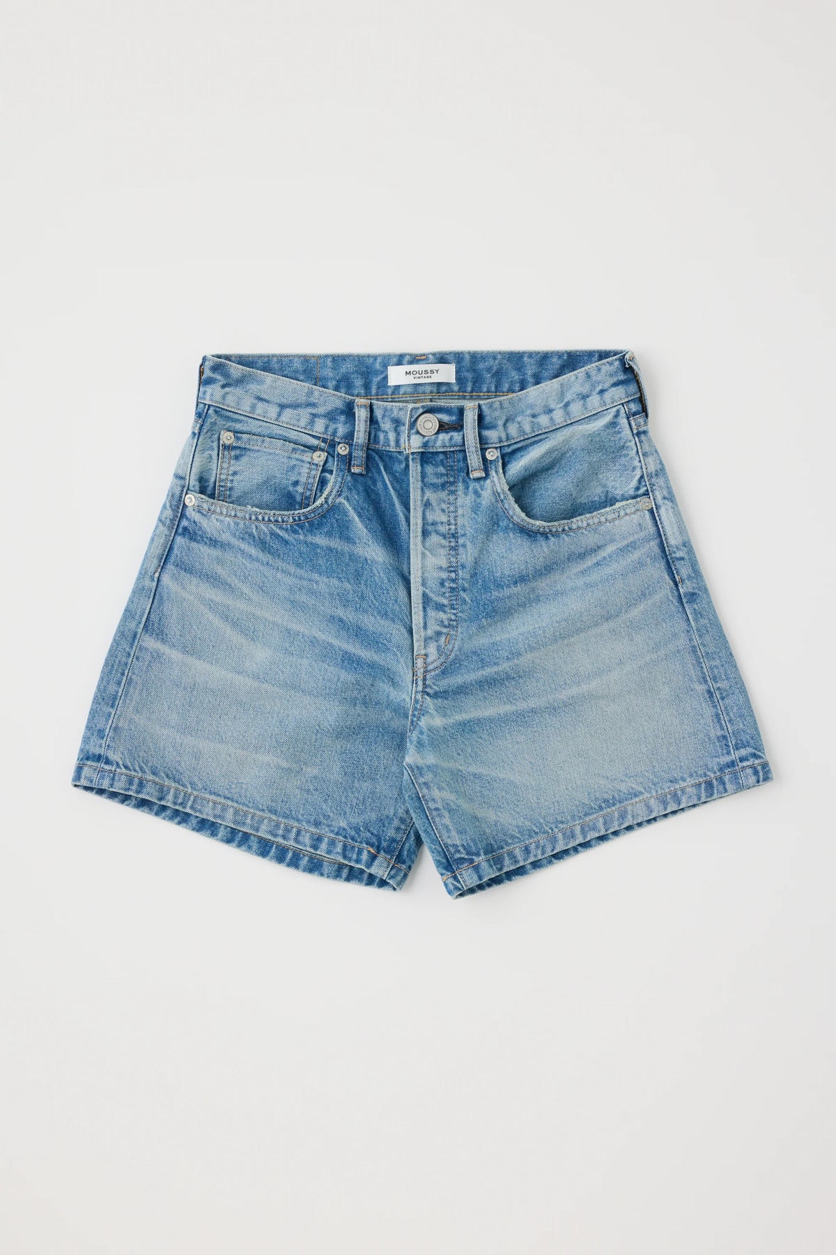 The Moussy Harrisburg Long Shorts, made from light stretch denim in light blue, feature a classic five-pocket design, belt loops, and a button fly. They are shown laid flat on a white background.