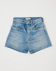The Moussy Harrisburg Long Shorts, made from light stretch denim in light blue, feature a classic five-pocket design, belt loops, and a button fly. They are shown laid flat on a white background.