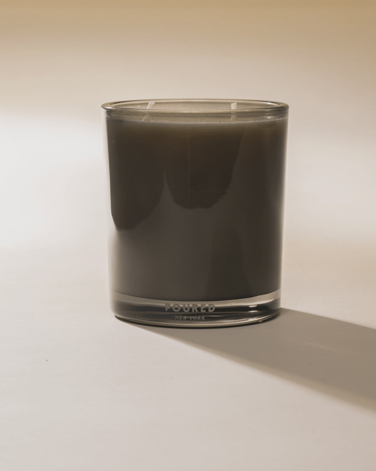 Dirty Girl Martini by Faire in a clear glass holder, styled under warm lighting for an inviting, upscale bar look.