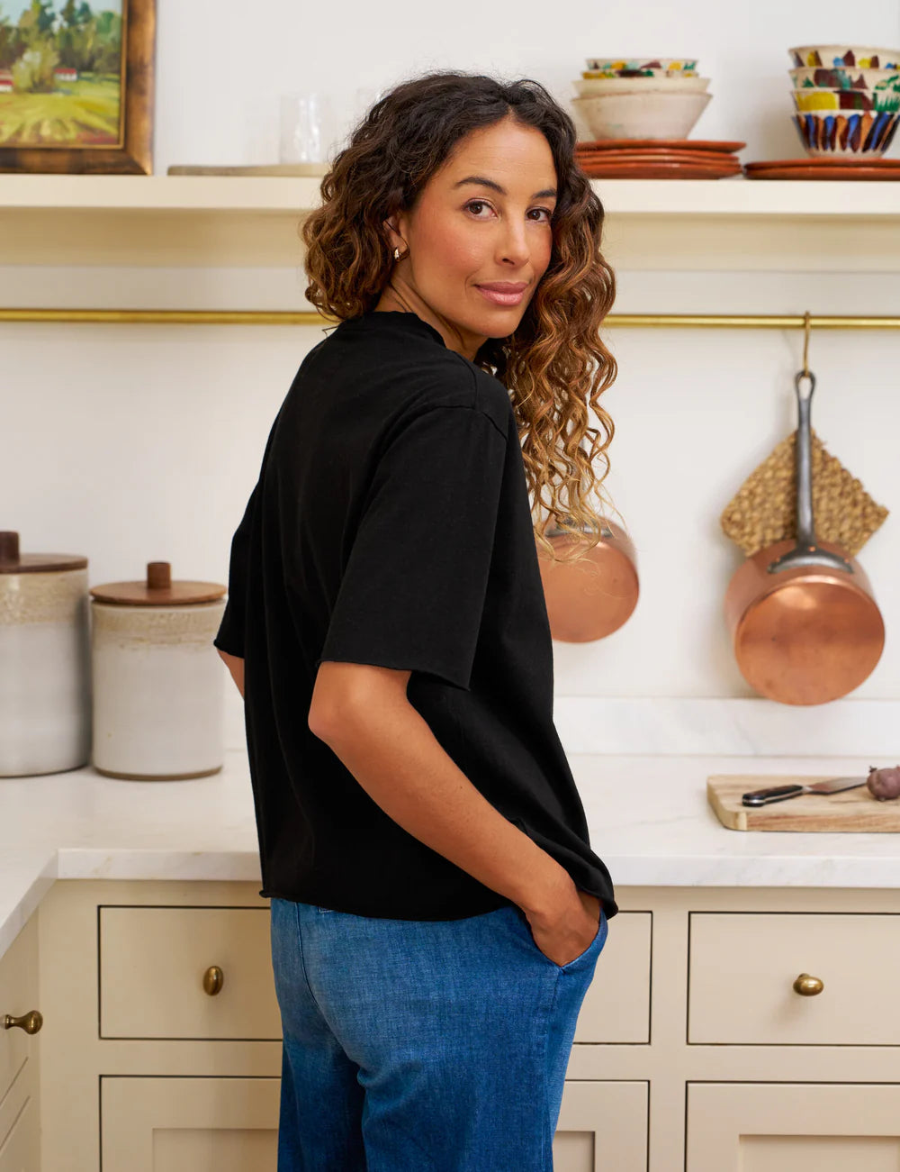 Black Frank & Eileen Perry NYC Crew Tee styled in a cozy kitchen setting with relaxed, casual elegance.
