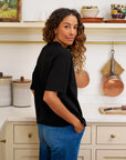 Black Frank & Eileen Perry NYC Crew Tee styled in a cozy kitchen setting with relaxed, casual elegance.
