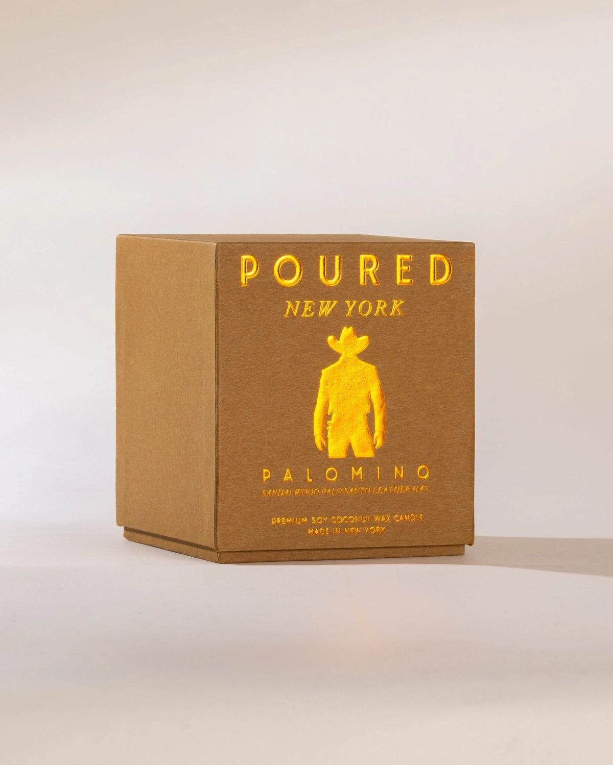 Brown Palomino box by Faire with yellow silhouette, sandalwood scent hints, perfect for home decor accents.