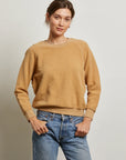 A person wearing the Perfectwhitetee Ziggy Reverse LS Sweatshirt and blue jeans stands against a plain light background, hands in pockets, gazing confidently at the camera.