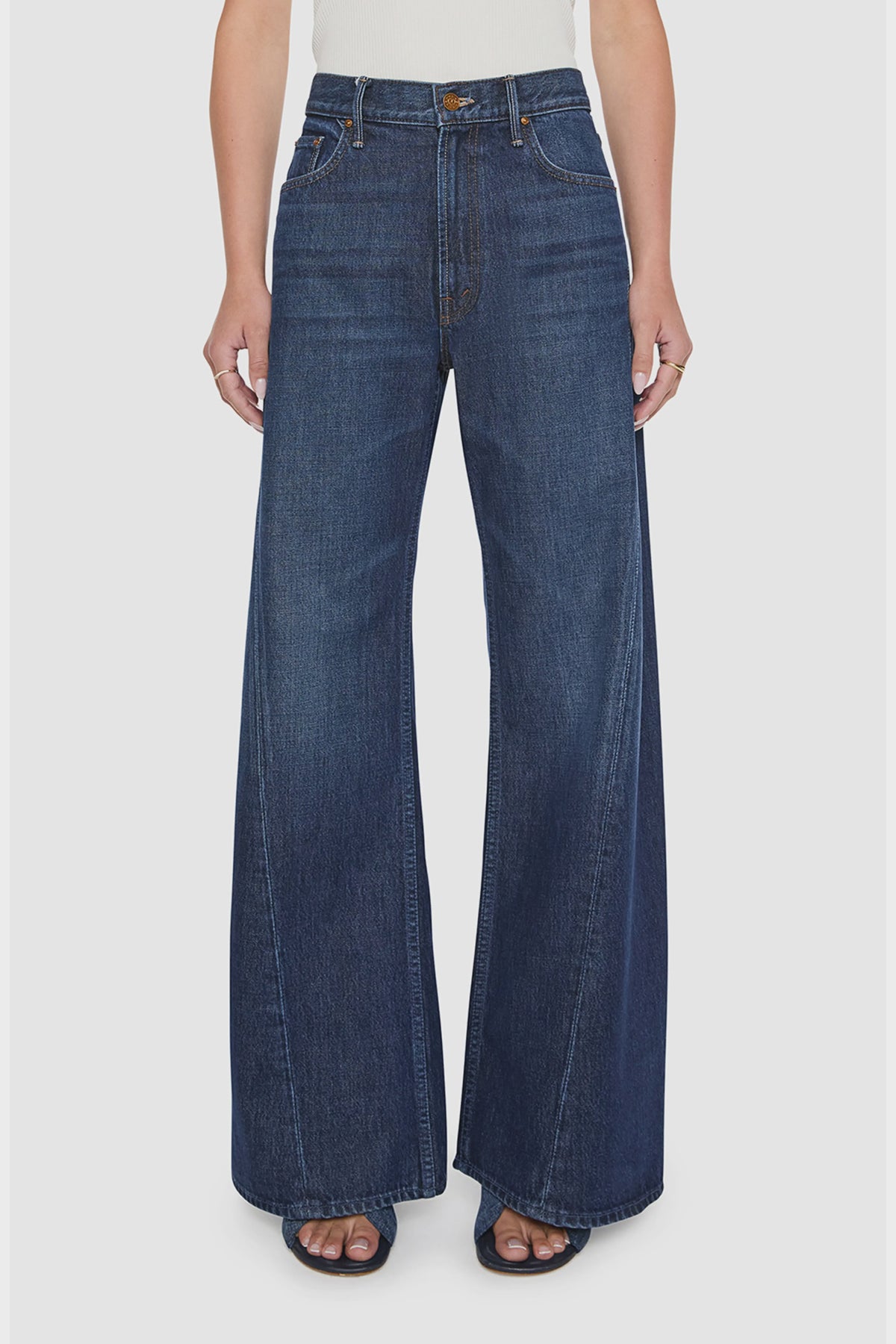 Mother Lil Lemon Twist Sneak dark wash high-waisted wide-leg jeans with twisted vertical seam detailing.