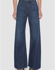 Mother Lil Lemon Twist Sneak dark wash high-waisted wide-leg jeans with twisted vertical seam detailing.
