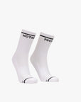 A pair of white tube socks from Mother, called "Baby Steps," featuring black stripes at the top and "MOTHER" on one sock and "FUCKER" on the other in black lettering.