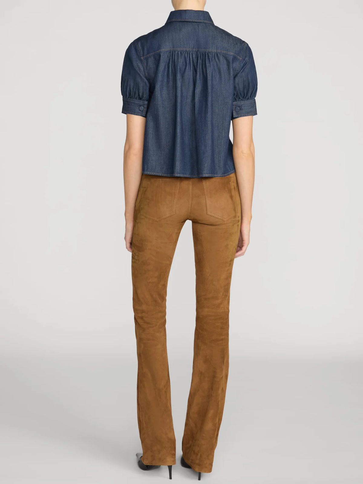 Lightweight denim Poise Top by FRAME with pointed collar, shown from the back.