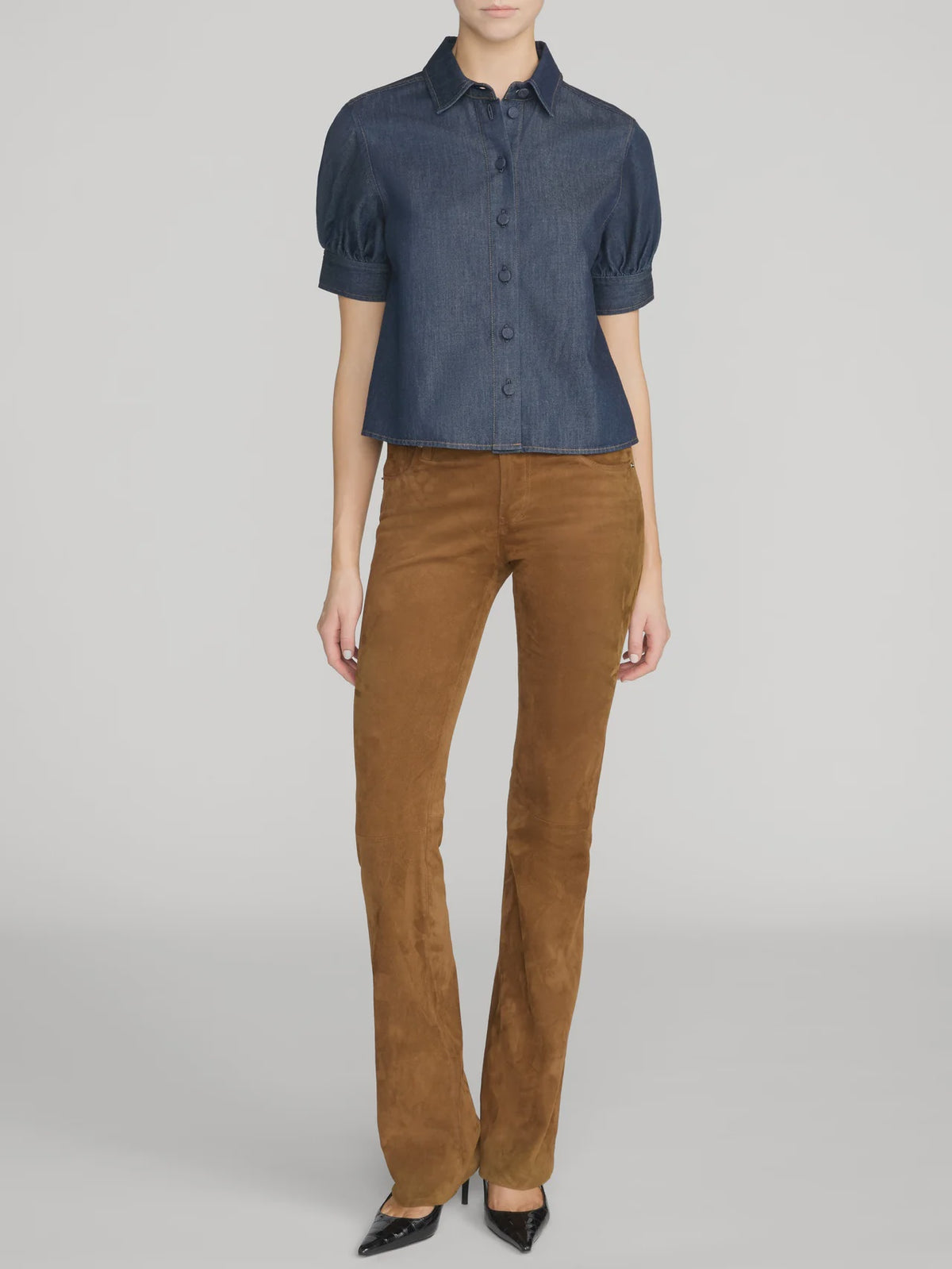 FRAME Poise Top lightweight denim shirt with covered buttons and pointed collar against gray background.