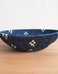 Dark blue and beige patterned Kabaya Large Bowl by Faire displayed on a wooden surface.