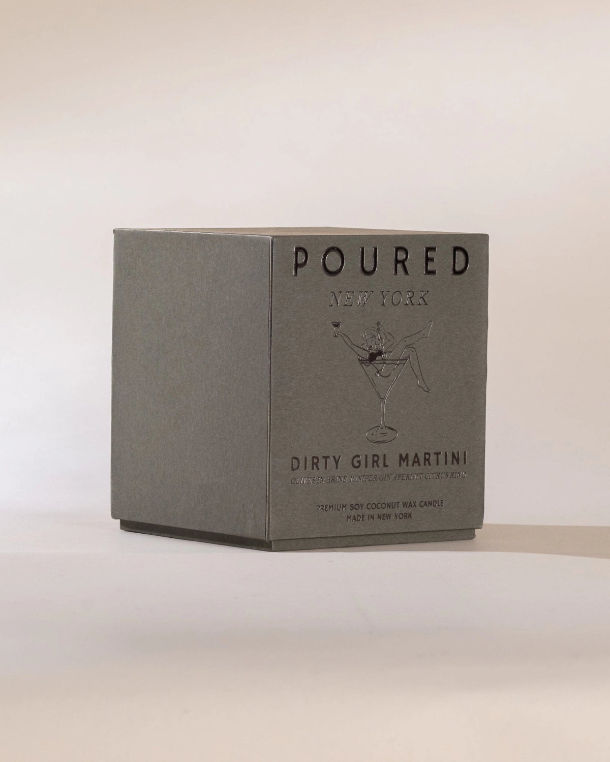 Gray Dirty Girl Martini box by Faire featuring illustration of a woman in a martini glass.