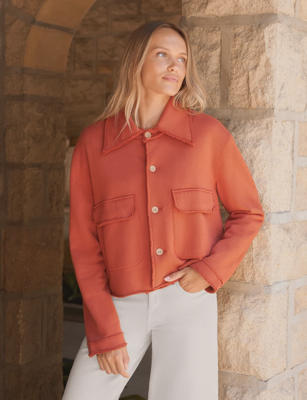 Rust-colored frayed cropped Rowan button-up jacket by Frank &amp; Eileen with two utility pockets.