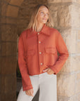 Rust-colored frayed cropped Rowan button-up jacket by Frank & Eileen with two utility pockets.