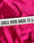 Glossy rectangular GIRLS WERE MADE TO DJ sticker in hot pink with black text from Bungalow Furniture & Accessories.