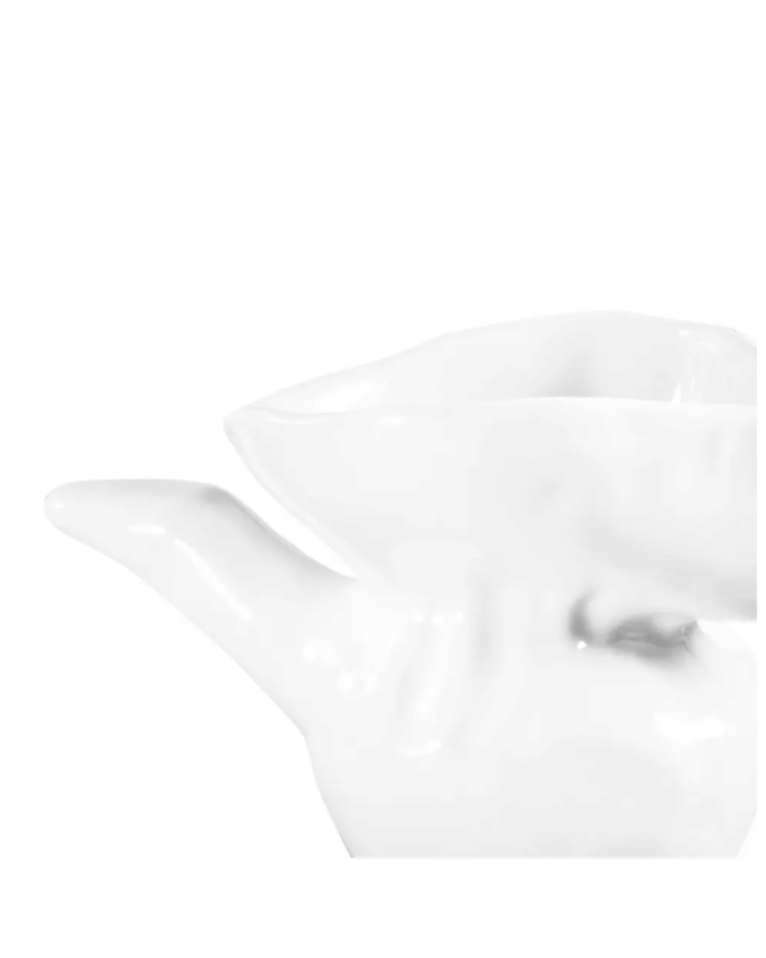 A close-up of the Montes Doggett 5157 Syrup Server No. 157, a glossy white handmade ceramic piece with a modern, abstract design, set against a plain white background. Only part of the spout and body is shown.