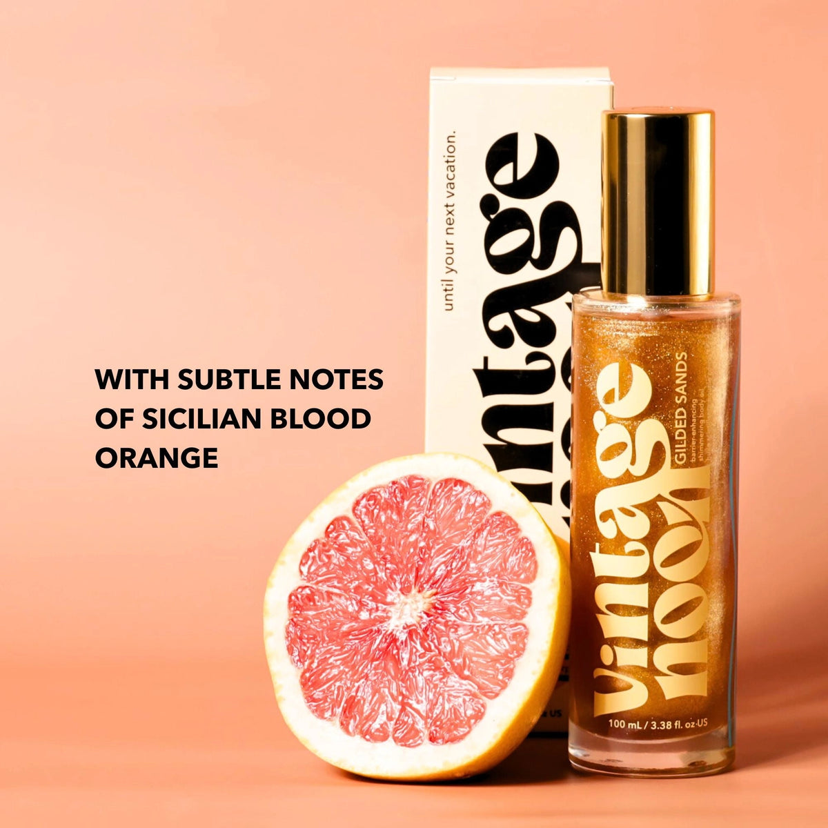 A bottle of Faire Shimmer Body Oil stands next to its box with a halved blood orange. Text reads: "With subtle notes of Sicilian blood orange and antioxidant-rich, shimmering body oil" on a peach background.