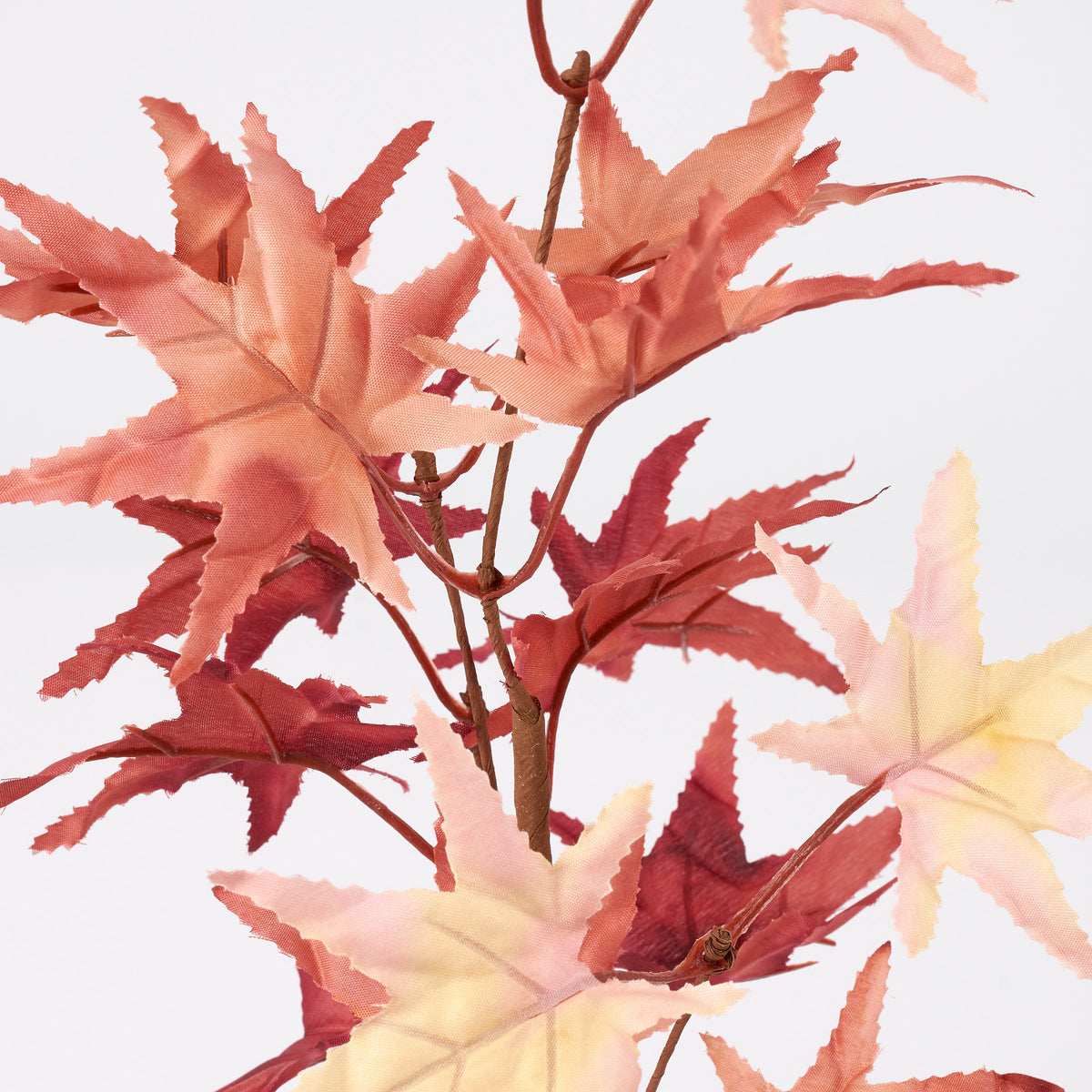 Beige faux maple floral pick on brown stems by Faire, perfect for fall decor at Bungalow Furniture & Accessories.