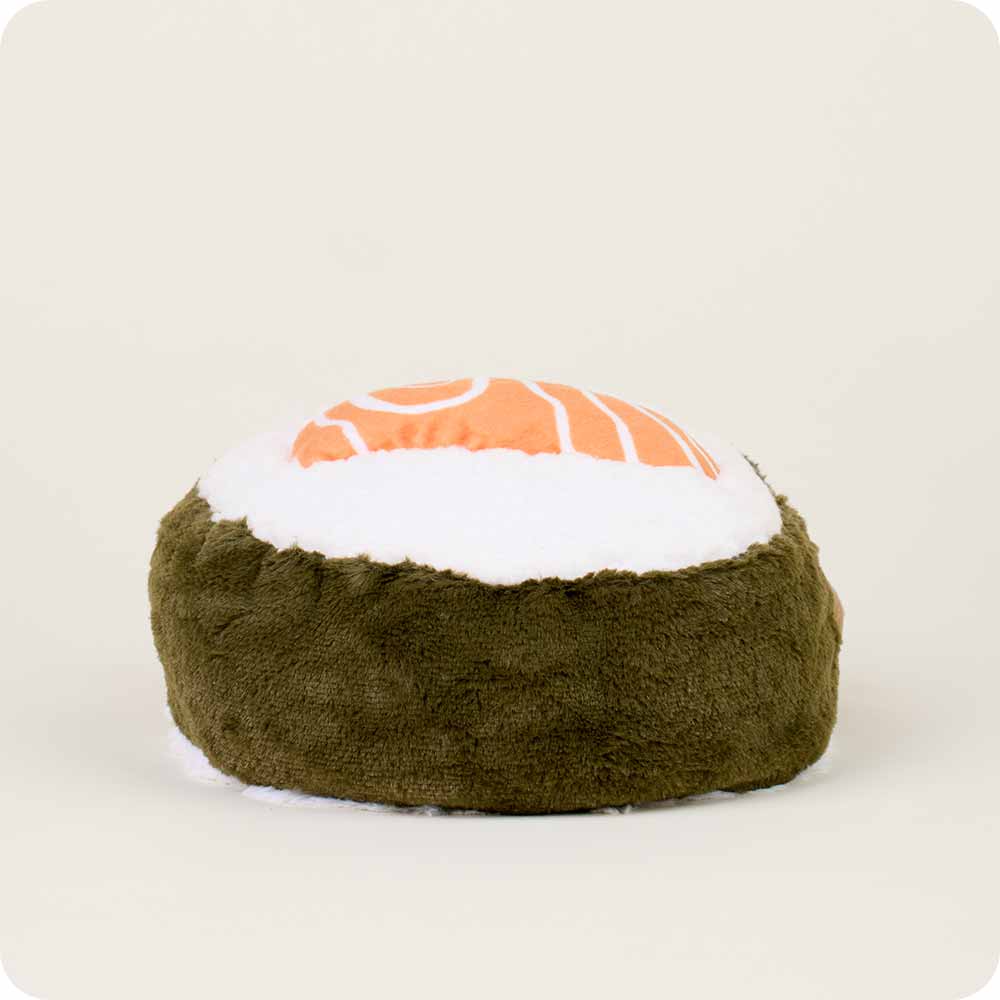 The Faire Salmon Sushi Warmies is a microwavable plush toy shaped like a salmon sushi roll, offering gentle warmth and cozy comfort. It features a white top, orange salmon pattern, and dark green seaweed base.